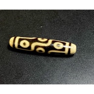 9-eyed ancient Dzi on scales