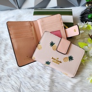 Kate Spade Medium Corner Zip Compact Bifold Wallet in Cream Saffiano Leather with Pineapple Print - 