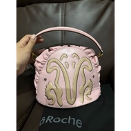 Marie de La Roche's pink shoulder bag