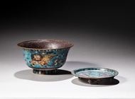 A cloisonné enamel 'lion' bowl and a 'chilong' tripod dish, Ming dynasty | 明 掐絲琺瑯瑞獅八寶紋盌 及 螭龍紋三足盤 一組兩