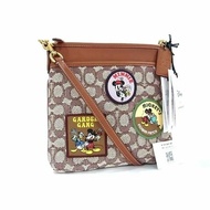 【COACH】滿版LOGO迪士尼聯名斜背方包-米奇緹花