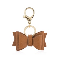 Itzy Ritzy Boss Bow; Bow Charm with Clasp Can Clip to a Diaper Bag, Purse, Keychain or Wallet; Cogna