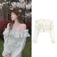Sweet princess-style chiffon off-the-shoulder dress with long sleeves and ruffles. Beautiful beachwe