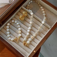 Ancient Method Gold High-End Feeling 18K Electroplating Winding Earrings Light Luxury Real Shell Fla