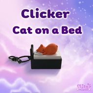 Niras • Clicker Cat on a Bed Keychain Toy Pressable Clicker Keychain