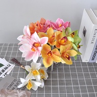 ช่อดอกไม้จำลอง Cymbidium ถือดอกไม้ 4 หัวและมือมัด Cymbidium 3D พิมพ์ความรู้สึกดอกไม้ผ้าไหมตกแต่งบ้าน