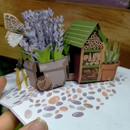 3D embossed paper card with images of a filled house -pop up card
