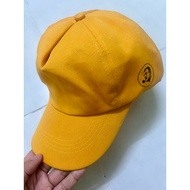 Bright yellow baseball cap