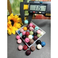 21 grams of 12 mm Glossy Milk Beads