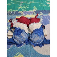 Fashionable women's bra with delicate lace design and diverse colors red, white and blue, size D75