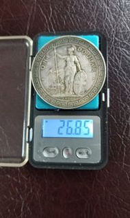 1907年B港光貿易銀一枚。五元平郵