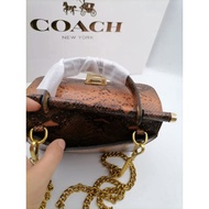 HandBeg tangan Coach