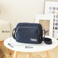 Fido Dido กระเป๋าสะพายข้างผ้า Oxford กันน้ํากระเป๋า Messenger แบบสบาย ๆ สําหรับผู้ชายและผู้หญิงกระเป