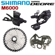 SHIMANO M6000กลุ่ม DEORE 4ชิ้น MTB 10ชุดเปลี่ยนเกียร์ M6000ความเร็วหลัง Derailleur M4100หรือ Sunshine 11-42T 11-46T ร้านอุปกรณ์รถจักรยาน HG54เทปคาสเซ็ตโซ่