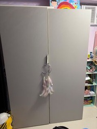Two-door grey wardrobe with storage shelves