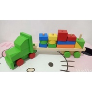 Truck-shaped wooden building blocks. Truck-shaped geometry blocks. Colorful wooden geometry blocks. 