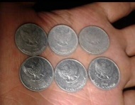 Uang koin 25 rupiah gambar pala set tahun
