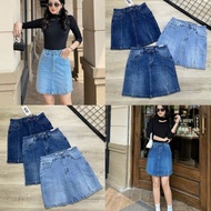 Exported stretch A-line jean skirt above the knee