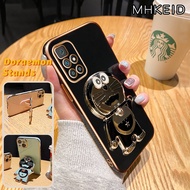 MHKEID Casing Ponsel untuk Xiaomi Redmi 10 Prime 10 5G 9C NFC 10A 8 8a Pro 7 7A Y3 Poco C31 Case Kartun Doraemon HP ponsel berdiri desain baru Plating lipat Kesing ponsel penuh penutup lensa kamera pelindung Casing