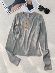 Skims Kardashian Cotton Ribbed Long-Sleeved T-Shirt Top As The Base Layer