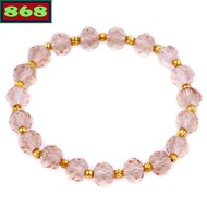 Brown glass bracelet with 8 cups of gold beads