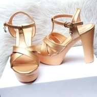 Women's shoes with 12-inch wedge heels. Designed to hug the feet and flatter the figure. The back of