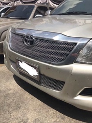 กระหน้าแต่ง Toyota Vigo Champ 2012 แชมป์ วัสดุ สแตนเลส ไม่ต้องเจาะ มีน็อตยึดให้เรียบร้อย ครอบของเก่า