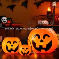 Pumpkin basket containing candy, halloween pumpkin candy basket for children