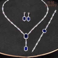 Exquisite T-shaped set with lab-grown sapphire necklace, ruby bracelet, and red diamond stud earring