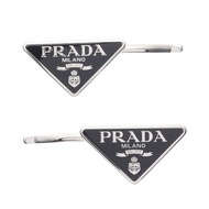 [มือสอง] กิ๊บติดผม Prada FERMAGLI รุ่น 1IF0512BA6F0002 สีเงิน/ดำ ทำจากสแตนเลส สำหรับผู้หญิง (ใหม่)