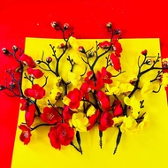Ancient peach branches decorate water towers, oan towers, and fortune cake towers CNY 2026