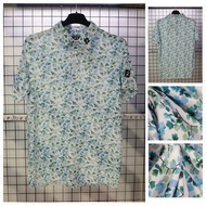 FJ golf polo shirt with gentle floral pattern, soft blue
