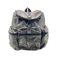 Pre-loved Agnes B Voyage Shiny dark green nylon mini backpack - multiple pockets (with flaws)