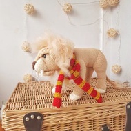 Soft toy lion in a scarf Gryffendor. Harry Potter symbol. Realistic lion figurin