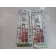 2 sets of steak forks and knives