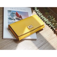 MK signature yellow wallet