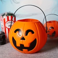 Handheld pumpkin candy basket for Halloween