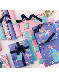 1套美人魚生日禮物包裝紙，清新甜美風格生日/節日禮物包裝紙，附4張不重複的美人魚主題包裝紙，還有配件和掛卡。