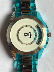 THE ONE 01 TURNING DISC 全鋼加透明藍色塑膠錶殼銀色錶面鋼加透明籃色塑膠錶帶手錶