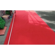 Red felt carpet covering the conference event floor