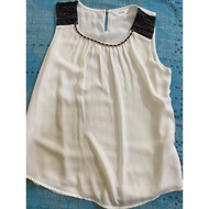 Beige colour sleeveless blouse