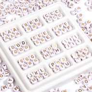 10 PIECES OF ALPHABET BEADS /ALPHABET BEAD SPECIAL WHITE WITH GOLD WRITING a - Z (YOU CAN CHOOSE)