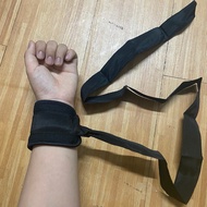 Patient arm fixation rope on bed, patient hand holding rope