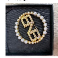 Brand no brand brooch