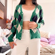 Green argyle knit sweater