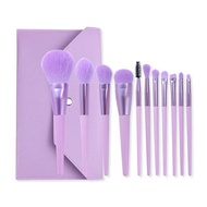 Bộ cọ trang điểm cá nhân GUVIET màu tím gồm 11 cọ đi kèm với túi da đựng cọ