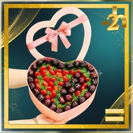 Imported fruit gift box mixed with fresh flowers as a gift for delivery to HCM Express Fruits to go