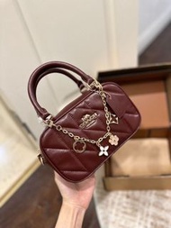 Coach Burgundy Diamond Quilted Mini Boston Handbag with Floral Charm Crossbody Strap