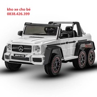 (Loại to ghế da)Xe ô tô điện đạp ga cho trẻ Mercedes G63 6 bánh bình 12V 2 chân ga 2 chế độ điều k