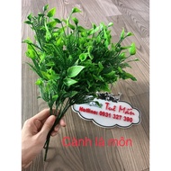 Branches with green anthurium leaves